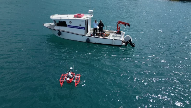 The president of the BioDesign Foundation searches for plastic fishing waste on a boat.